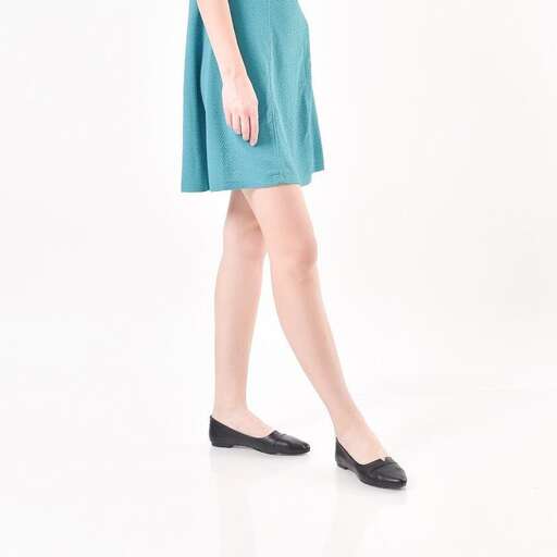a model in a teal dress