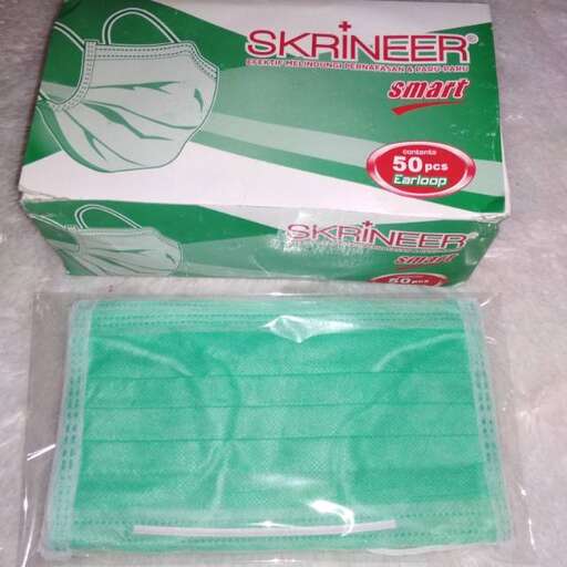 a green plastic bag with a plastic bag inside