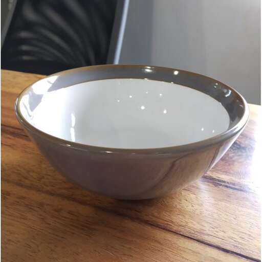a bowl of milk on a table