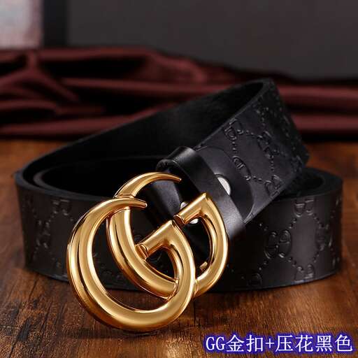 a black belt with gold leaf and a gold ring