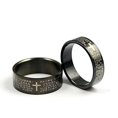 a pair of men's wedding rings with a cross on each ring.