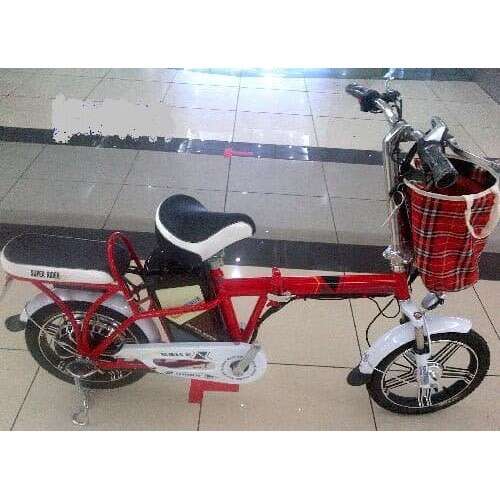a red and white bike parked in a room.