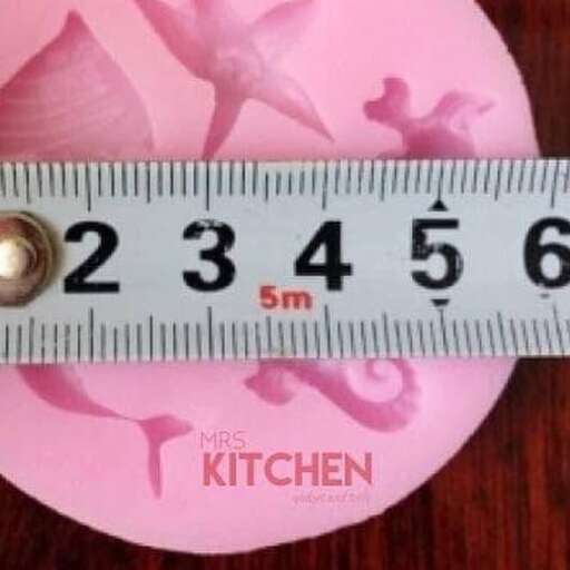 a measuring tape measure sitting on top of a measuring tape.