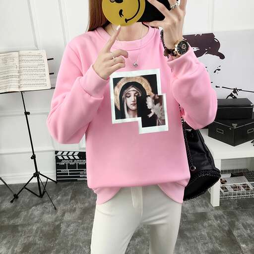 a picture of a girl in a pink sweater with a picture of her face
