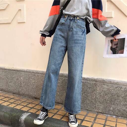 a pair of jeans with a striped sweater and a pair of sneakers.