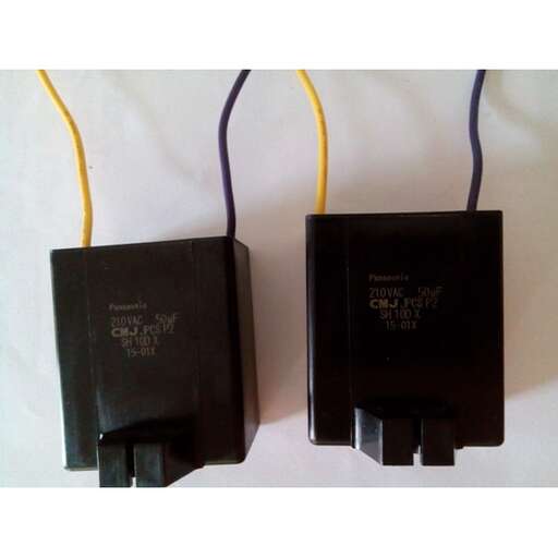 two black electrical outlets with yellow wire attached to them.