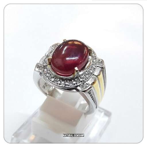 a ring with a red stone