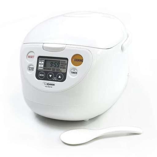 a white crock pot sitting on a white surface.