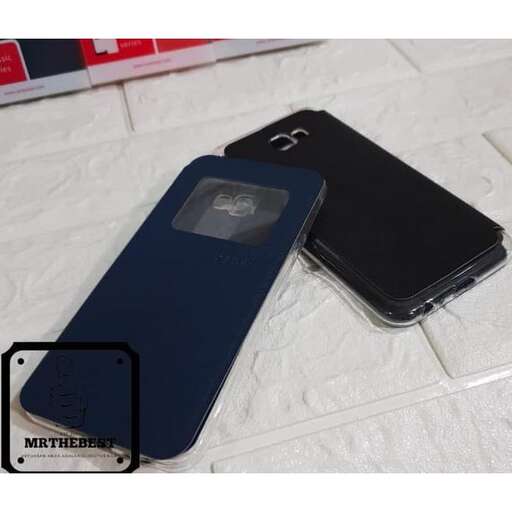 a couple of cell phones sitting on top of a white surface.