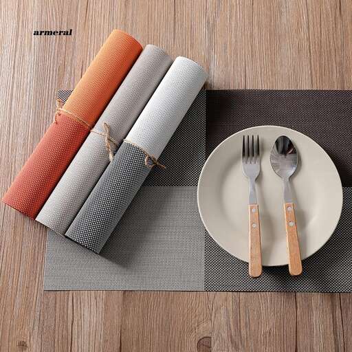 a place mat with a fork and knife on it.