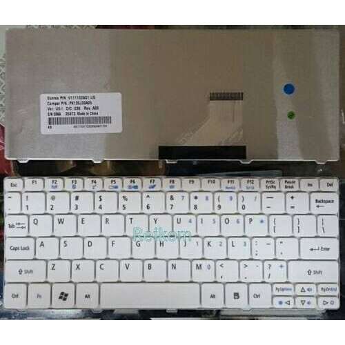 a computer keyboard with a note on the front of it.