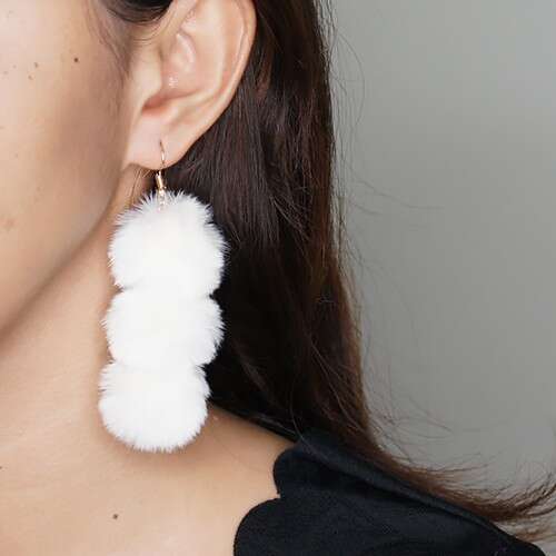 earrings with a white feather