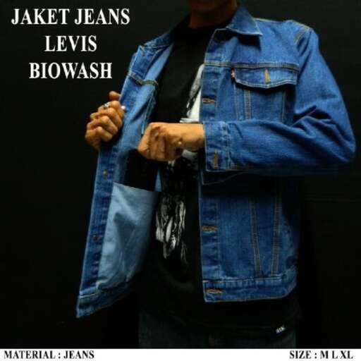 a man in a denim jacket and jeans.