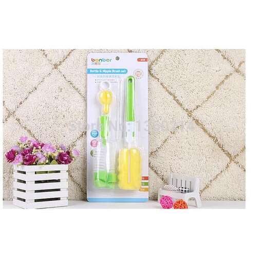 a white shelf holding a pair of yellow handled scissors.