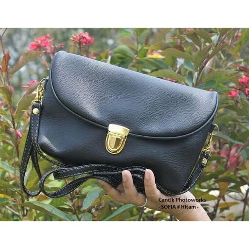 black leather bag with a gold buckle.