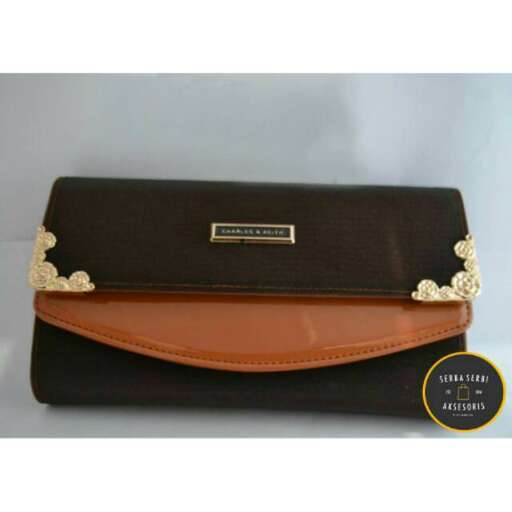 black leather bag with a gold clasp