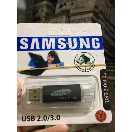 a person holding a small box with a small battery.