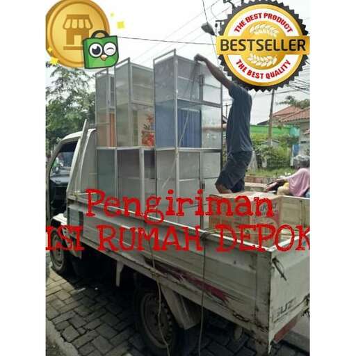 a truck with a man sitting on top of it.