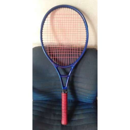 a close up of a tennis racket