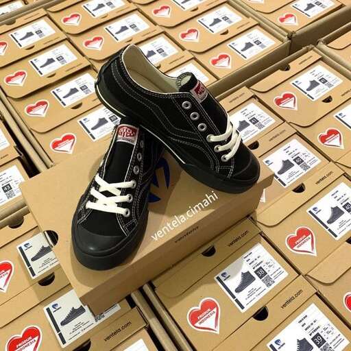 a pair of black shoes on a box