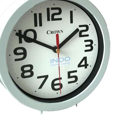 a large clock with a black face and red hands.