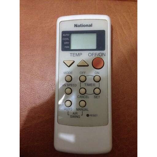 a remote control with a digital screen showing the time.