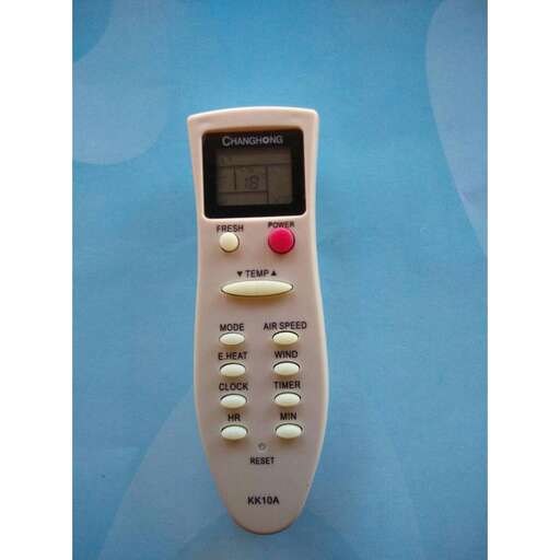 a white electronic device with a red button on it.