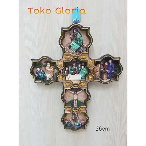 a cross made of glass with a photo of a family of friends in the middle.