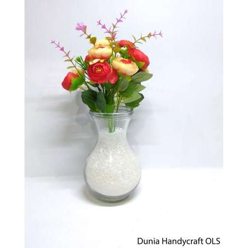 a vase filled with flowers sitting on top of a table.