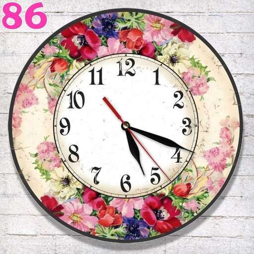 a clock with flowers on it is displaying the time.