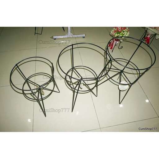 a set of chairs and a flower arrangement in a display case.