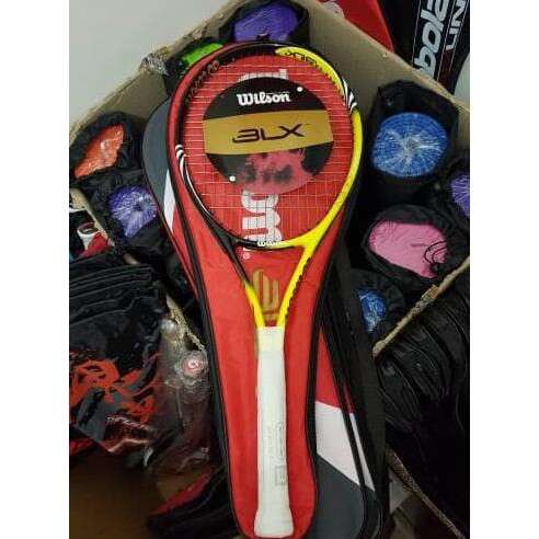 a tennis racket is in a shoe box.