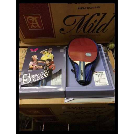 a box with a pair of books and a mouse