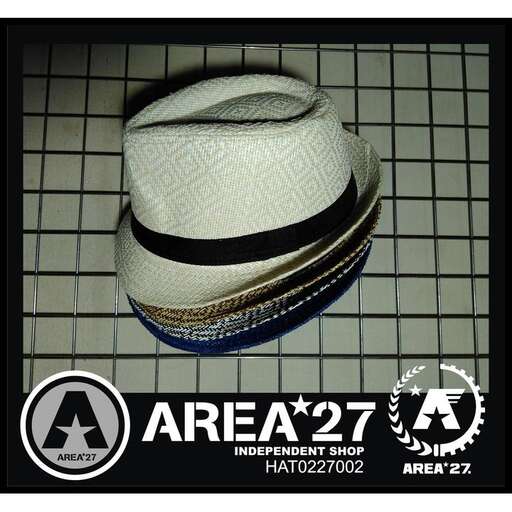 a hat is sitting on a tile floor.