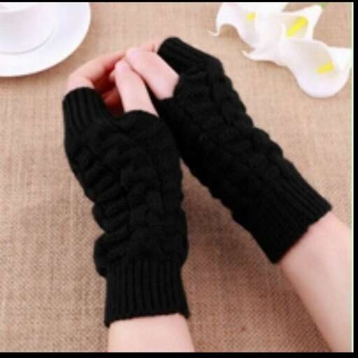 a person's hand with a glove on their left hand.