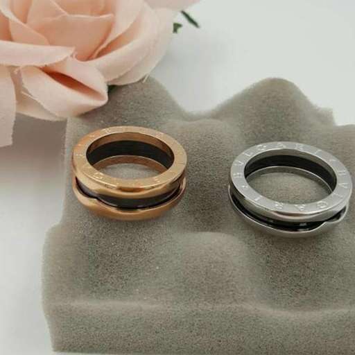 a pair of rings with a pink rose.