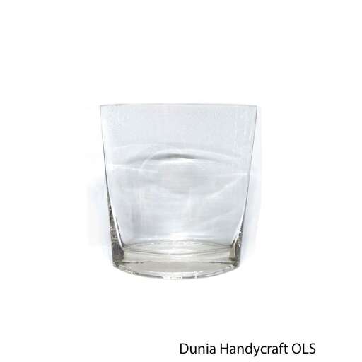 a glass of water with ice in it.