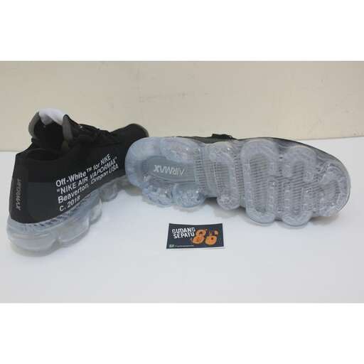 a pair of shoes with a plastic bag on top.