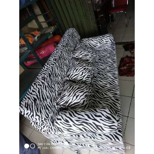 a zebra print pillow on a chair