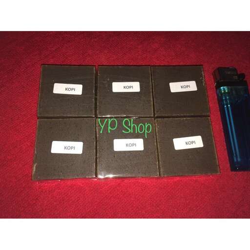 a box of cigarettes sitting on top of a red surface.