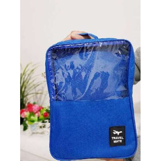 a blue bag with a picture of a child's face on it.