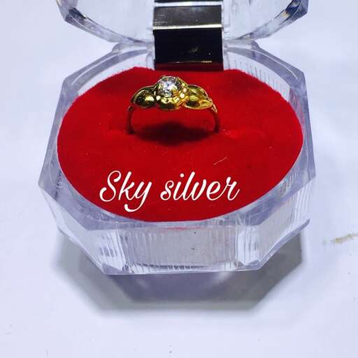 engagement ring in a glass bottle