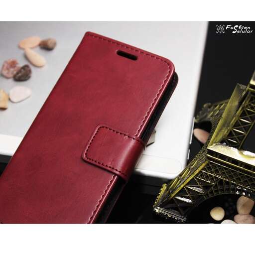 a red leather case with a gold case and a gold clock.