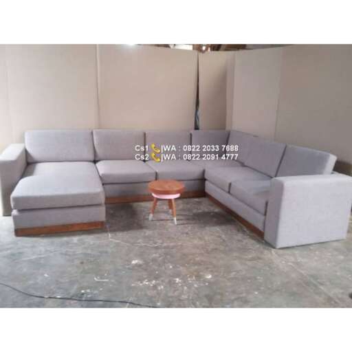 a large sectional sofa with a side table.