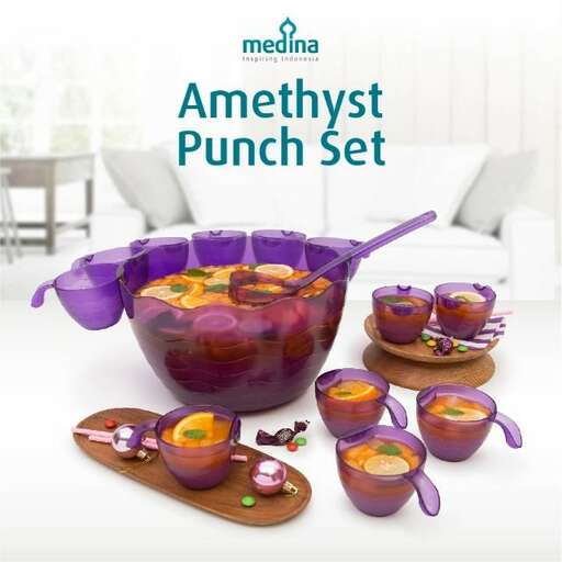a purple bowl of fruit and vegetables.