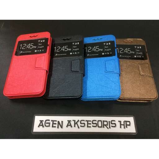 a number of different colored cell phones on a table.
