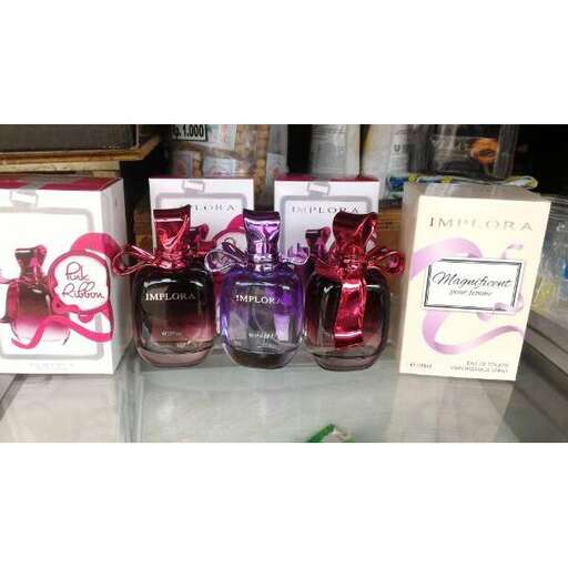 a display of perfume bottles in a store window.