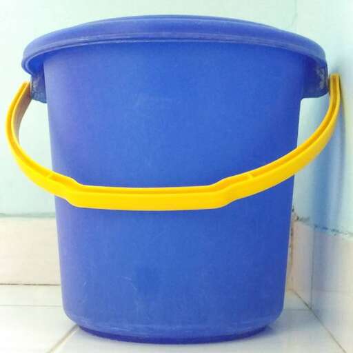 a blue bucket with a yellow handle.