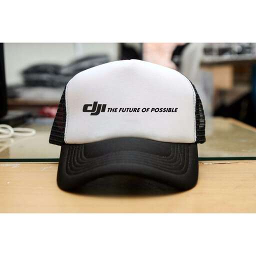 a black and white baseball cap with the words on the front.