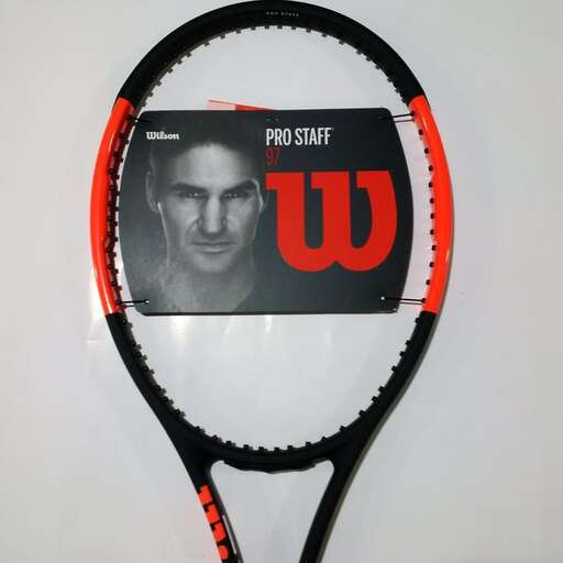 a tennis racket with a picture of a tennis player on it.